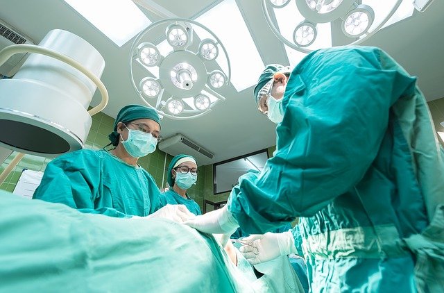 image of doctors inside a room conducting a surgery
